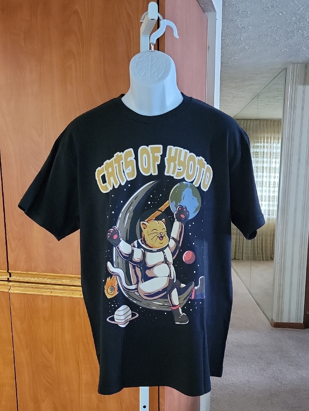 CATS OF KYOTO BLACK GRAPHIC T-SHIRT WITH A PLAYFUL CARTOON STYLE SPACE THEME